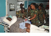 A victim of the explosion receiving treatment at the 37 Military hospital