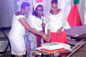 Mrs Barbaro Oduro-Toku (L) cutting the cake with Pastor Rita Ampofo ICGC, Hosanna Temple (Middle)