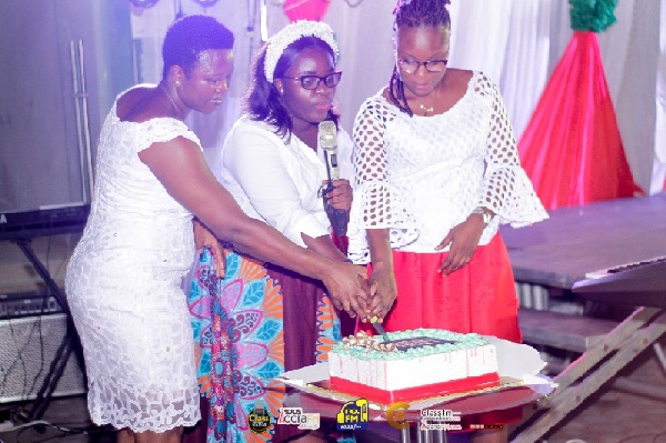 Mrs Barbaro Oduro-Toku (L) cutting the cake with Pastor Rita Ampofo ICGC, Hosanna Temple (Middle)