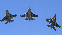 Pakistan's F-16 jets fly past over the president's house during the national day parade in Islamabad