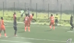 Players of Nations FC and Holy Stars during the game