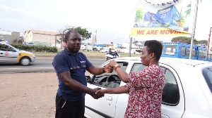 GM of Toptech, Mrs Anna Appiah handing over keys to the car to Anthony Anlimah