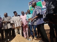 Vice President Dr Bawumia with shovel after cutting sod for the project to commence