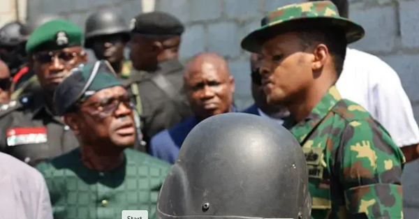 FCT Minister, Nyesom Wike and a naval officer, Ahmed Yerima, during an altercation