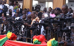 Some media men covering an event