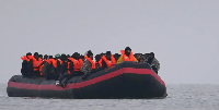 People thought to be migrants onboard a small boat in Gravelines, France