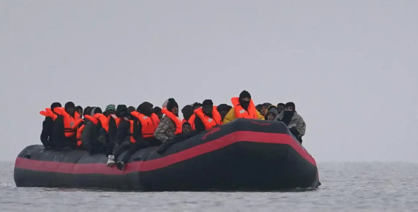 People thought to be migrants onboard a small boat in Gravelines, France