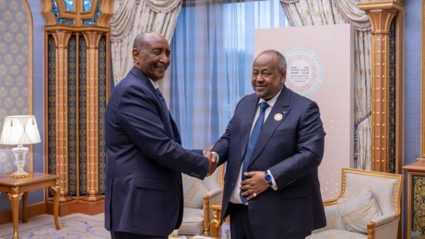 Sudanese leader, Abdel Fattah al-Burhan (L) shakes hands with Djibouti President, Ismail Oguelleh