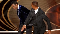 Will Smith hits Chris Rock on stage while presenting the award for best documentary at the Oscars