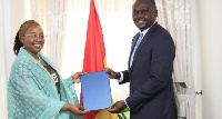 Ms. Angela Lusigi presenting her letter to Deputy Foreign Affairs Minister, Charles Owiredu