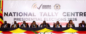 EC Chairperson Justice Simon Byabakama sits with other Commissioners to announces initial results