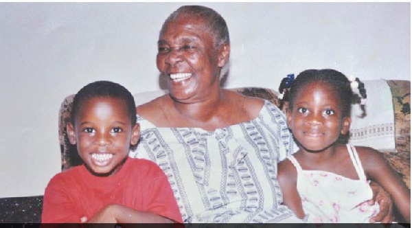The late Madam Evelyn Charity Nornoo flanked by some of her grandchildren.