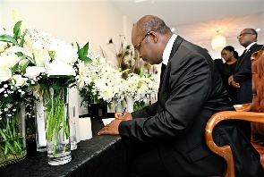 BoG Governor, Dr. Ernest Addison signing the book of condolence