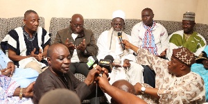 Akufo-Addo interacting with the Chief Imam