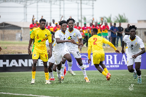 Ghana in white, beat Benin in yellow, to progress to the semis of the tournament