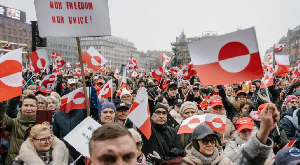 Protesters in Copenhagen waved Greenland's white and red flag in support of self-determination