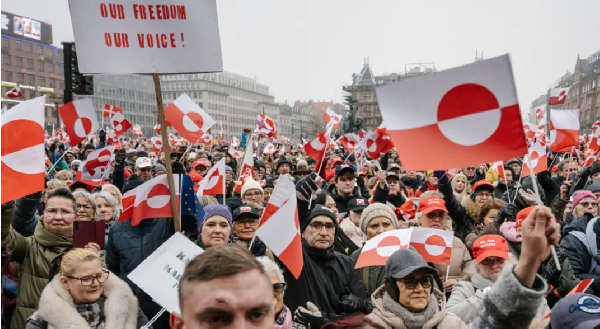 Protesters in Copenhagen waved Greenland's white and red flag in support of self-determination