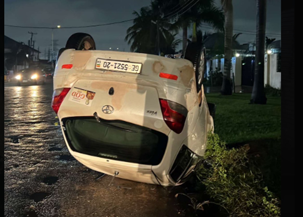 A white vehicle has somersaulted following a heavy downpour on Wednesday