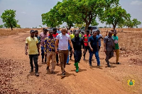 Dr Peter Boamah Otokunor among other officials touring the area