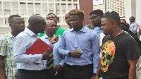 Wisa (in blue shirt) at the court premises