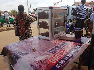 Ursula's banner being used to sell fried yam and pork at Madina Zongo junction