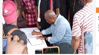 John Dramani Mahama signing the book of condolence