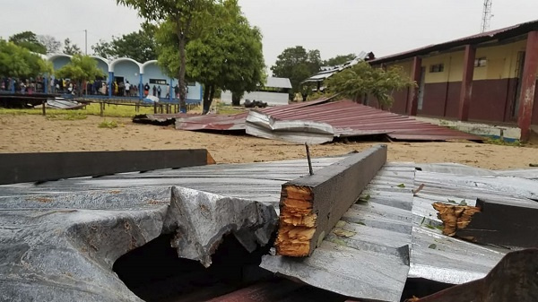 The damaged roof of a school lies in the playground in Vilanculos, Mozambique, on Feb. 24, 2023