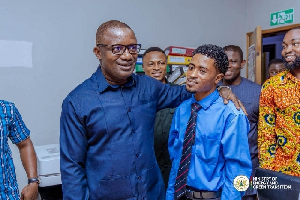 Energy minister interacting with staff