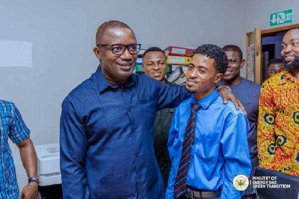 Energy minister interacting with staff