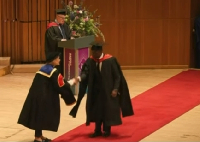 Emmanuel Armah-Kofi Buah receiving his award in London