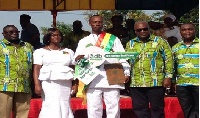 President Mahama in a pose with the National Best farmer, Mr Crentsil