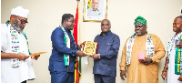 The AU special envoy confering the award on Eric Opoku