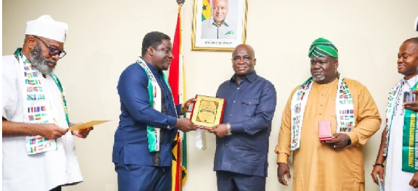 The AU special envoy confering the award on Eric Opoku