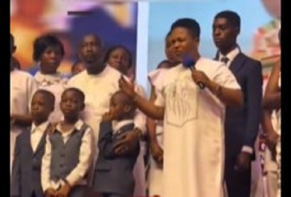 Apostle Lilian Kumah (with the microphone) with other relatives of John Kumah during the service