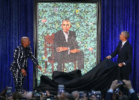 Kehinde Wiley and former President Barack Obama unveil his presidential portrait during a ceremony