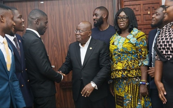 Akufo-Addo interacting with NUGS president Dennis Appiah Larbi-Ampofo (third from left)