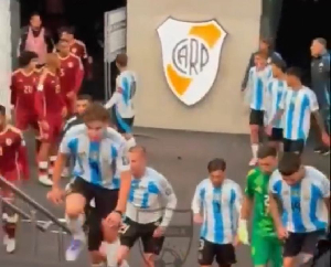 Messi (red armband) headed towards the Venezuela team at half time