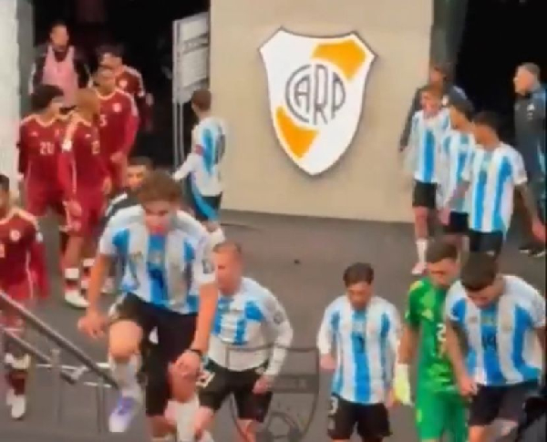 Messi (red armband) headed towards the Venezuela team at half time