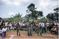 CODECO militiamen and members of the Lendu community attend a meeting with former strongmen in Wadda