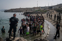 Migrants who crossed into Spain return to Morocco from the Spanish enclave of Ceuta