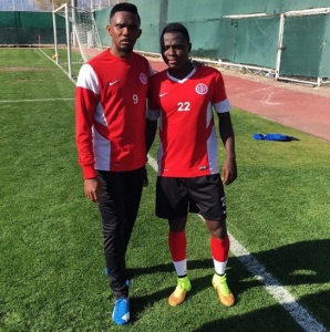 Ghana defender Samuel Inkoom with Samuel Eto'o