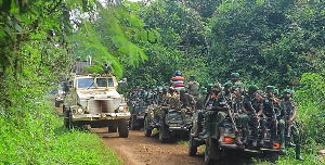 DR Congo soldiers and UN forces patrol near Oicha after attack