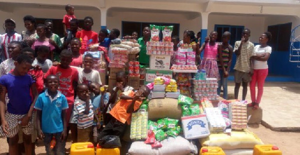 File photo: Children in an orphanage in Ghana receive food donations