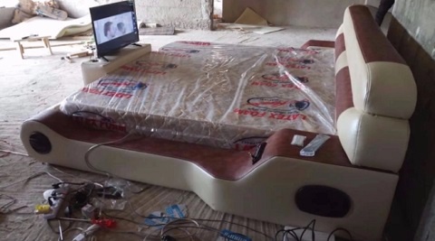 A newly constructed electronic bed that comes with a television