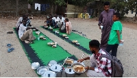 Displaced Sudanese prepare to break their fast at a displacement camp during the month of Ramadan
