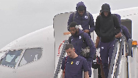 Players of England getting down from a plane