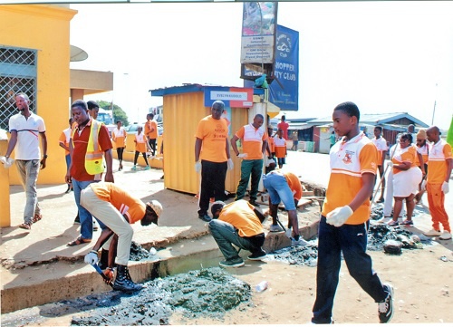 Students of the Osagyefo Leadership International School engaged in a cleanup exercise