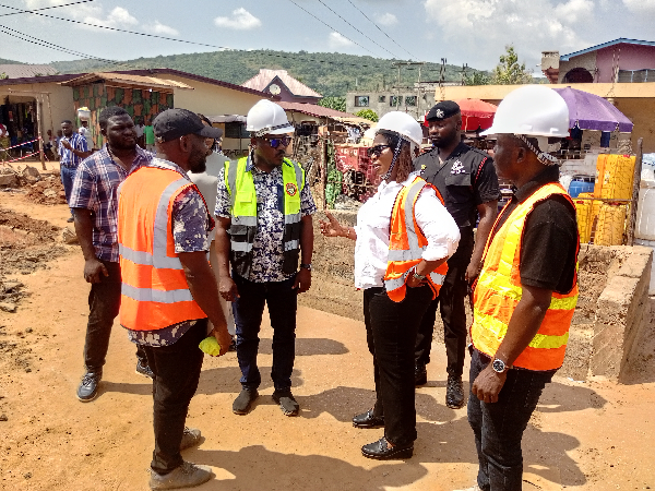 The minister with the MCEs for Lower Manya, Yilo Krobo and some contractors