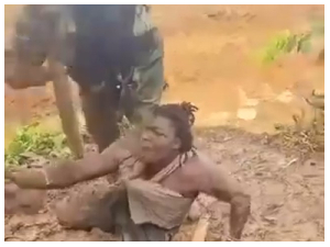 A picture of the 'galamseyer' being disciplined by a NAIMOS official