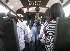 A young man preaching in a trotro